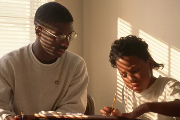 Older and Younger Child doing work